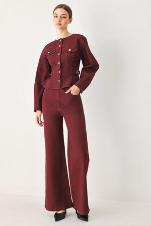 Woman wearing a long-sleeve jacket in deep burgundy with gold-tone buttons | FREEMARKET