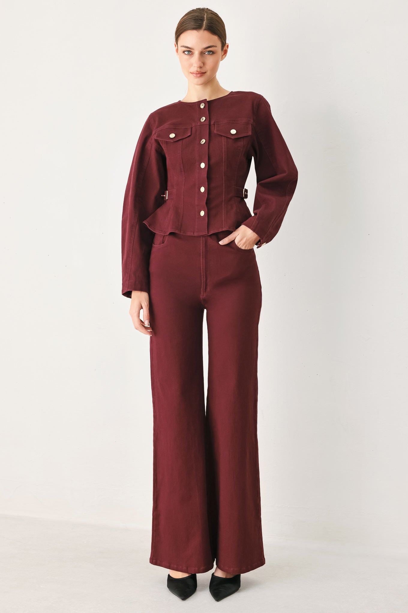 Woman wearing a long-sleeve jacket in deep burgundy with gold-tone buttons | FREEMARKET
