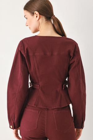 Woman wearing a long-sleeve jacket in deep burgundy with gold-tone buttons | FREEMARKET