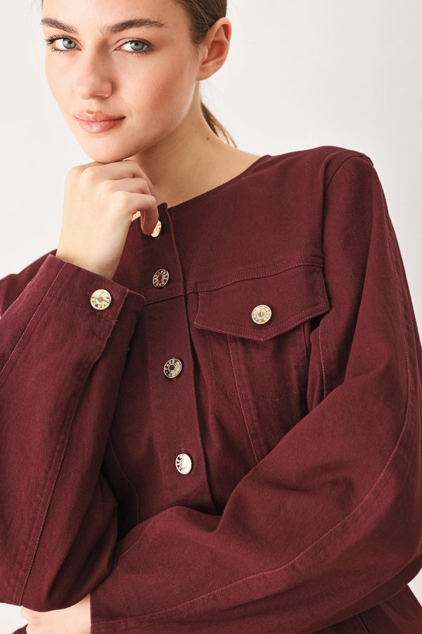 Woman wearing a long-sleeve jacket in deep burgundy with gold-tone buttons | FREEMARKET