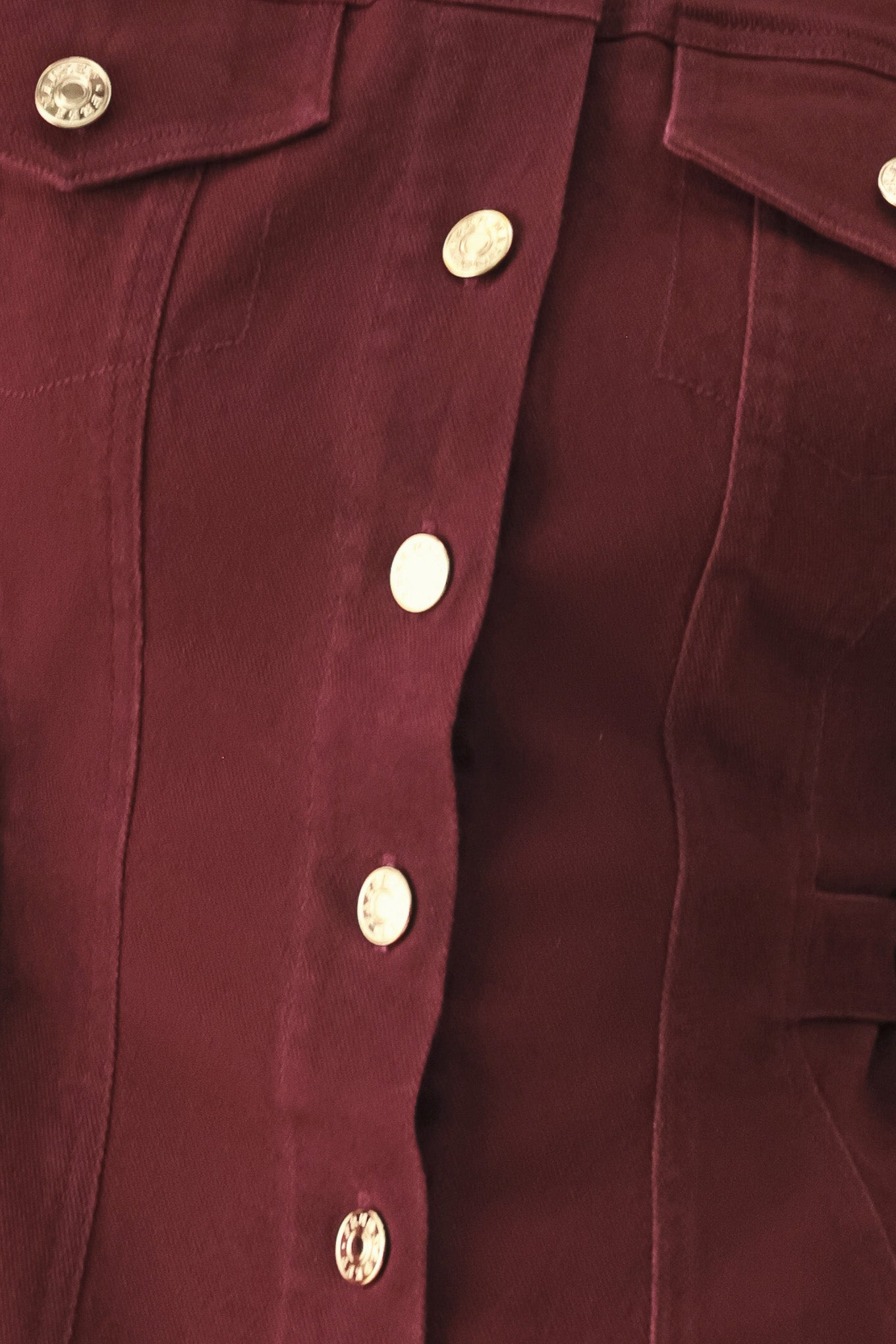 Woman wearing a long-sleeve jacket in deep burgundy with gold-tone buttons | FREEMARKET