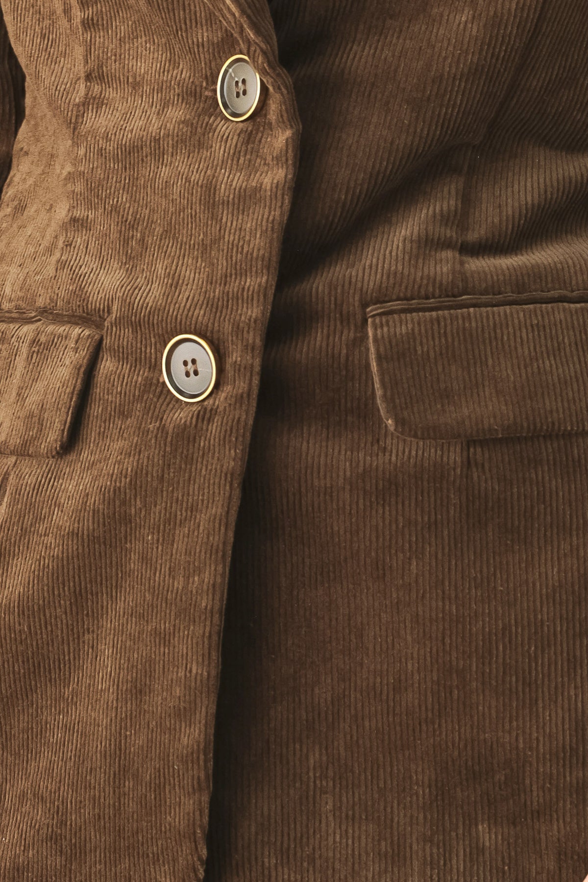 A woman wearing a brown corduroy blazer | FREEMARKET