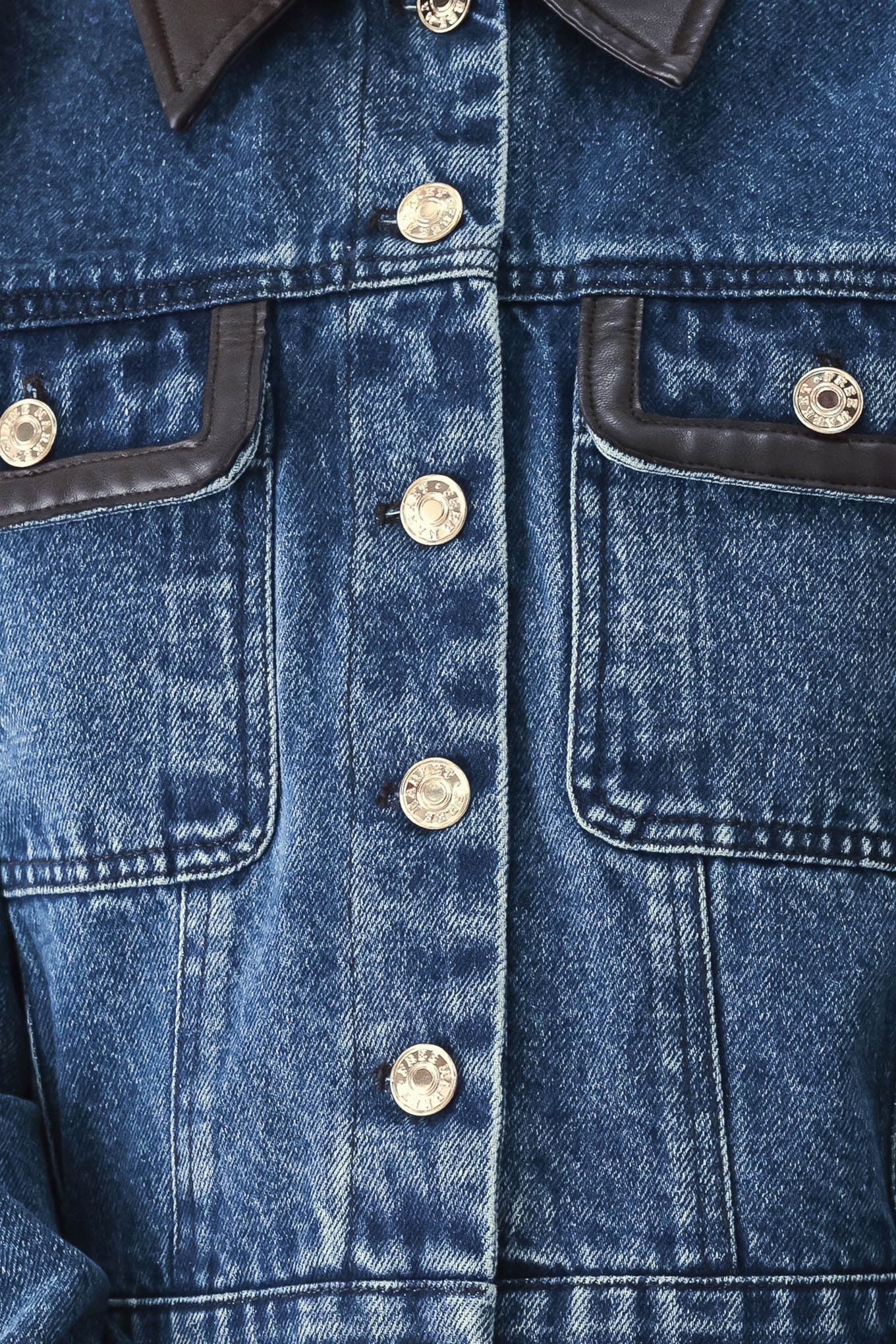 A model wearing a blue denim jacket with dark brown leather-look trim details on the collar | FREEMARKET