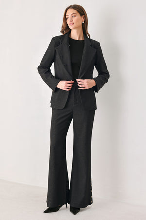 Woman wearing a black blazer military jacket with three buttons and faux pockets | FREEMARKET