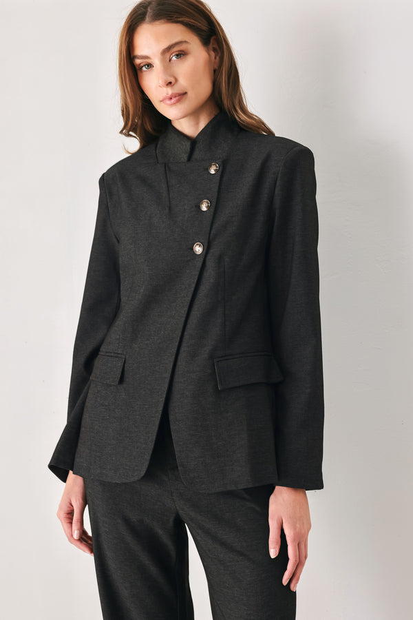 Woman wearing a black blazer military jacket with three buttons and faux pockets | FREEMARKET