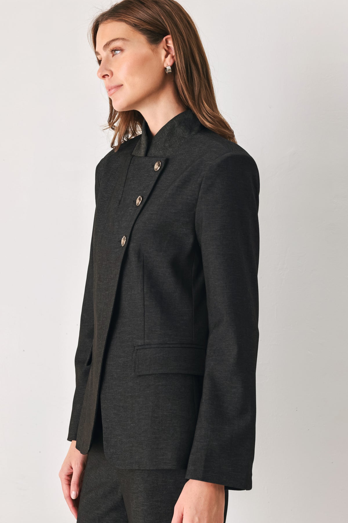 Woman wearing a black blazer military jacket with three buttons and faux pockets | FREEMARKET