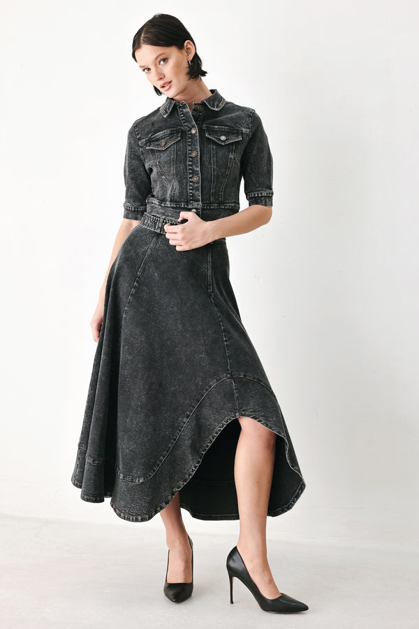 A model wearing a cropped, short-sleeved black acid-wash denim jacket with a band collar and button front | FREEMARKET