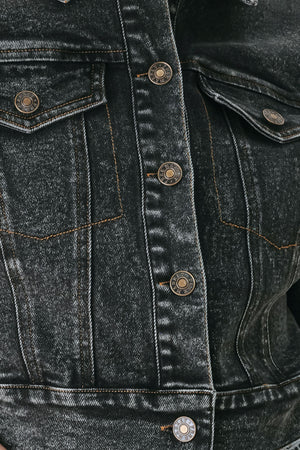 A model wearing a cropped, short-sleeved black acid-wash denim jacket with a band collar and button front | FREEMARKET