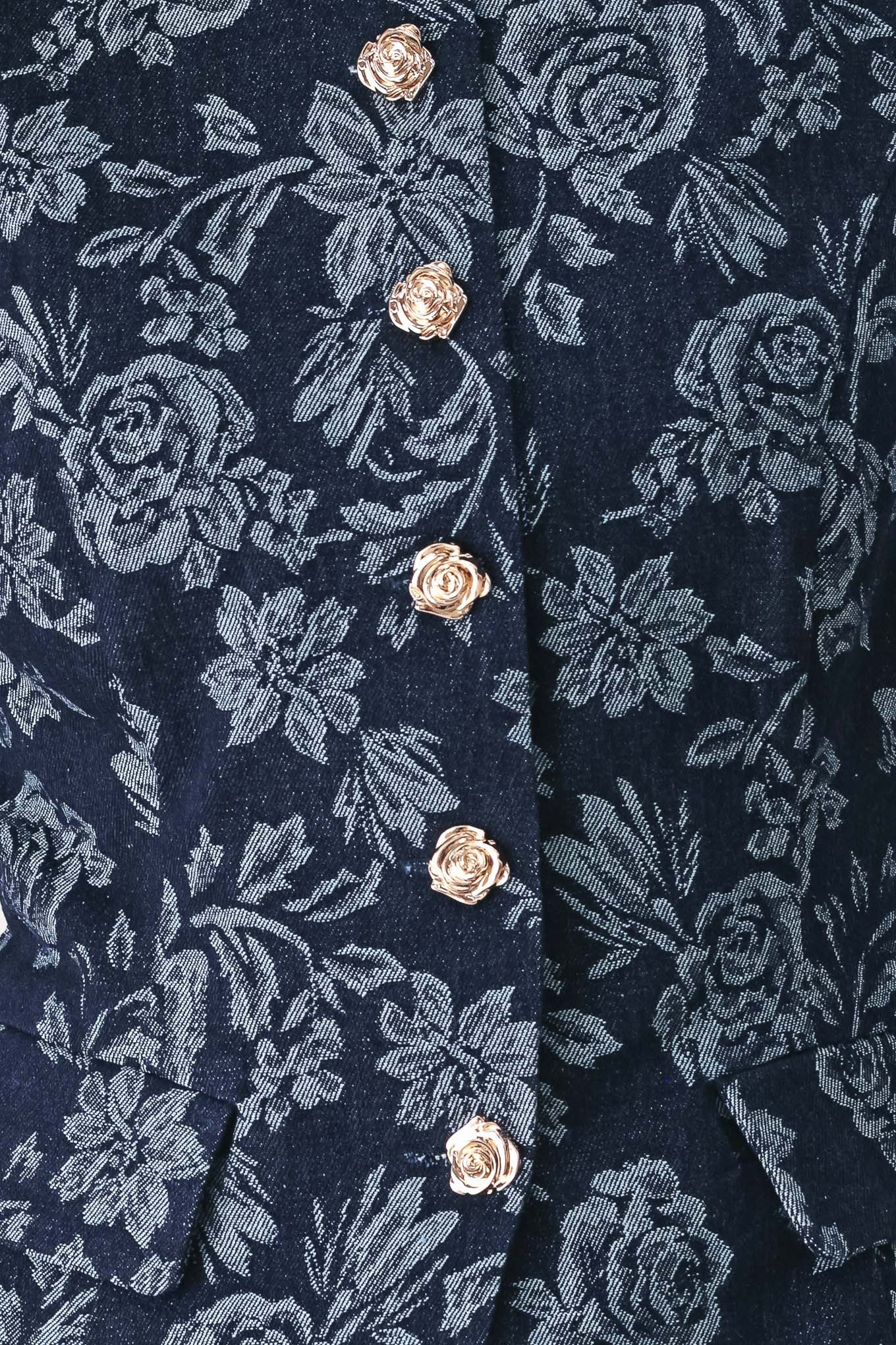 A woman wearing a sleeveless navy blue denim jacquard vest with a light blue floral pattern and gold-tone buttons down the front | FREEMARKET