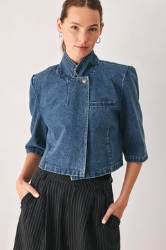 A woman wearing a cropped blue denim jacket with a high stand collar, structured shoulders, and elbow-length sleeves | FREEMARKET