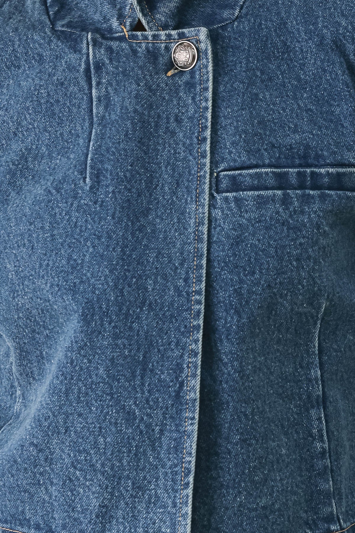 A woman wearing a cropped blue denim jacket with a high stand collar, structured shoulders, and elbow-length sleeves | FREEMARKET