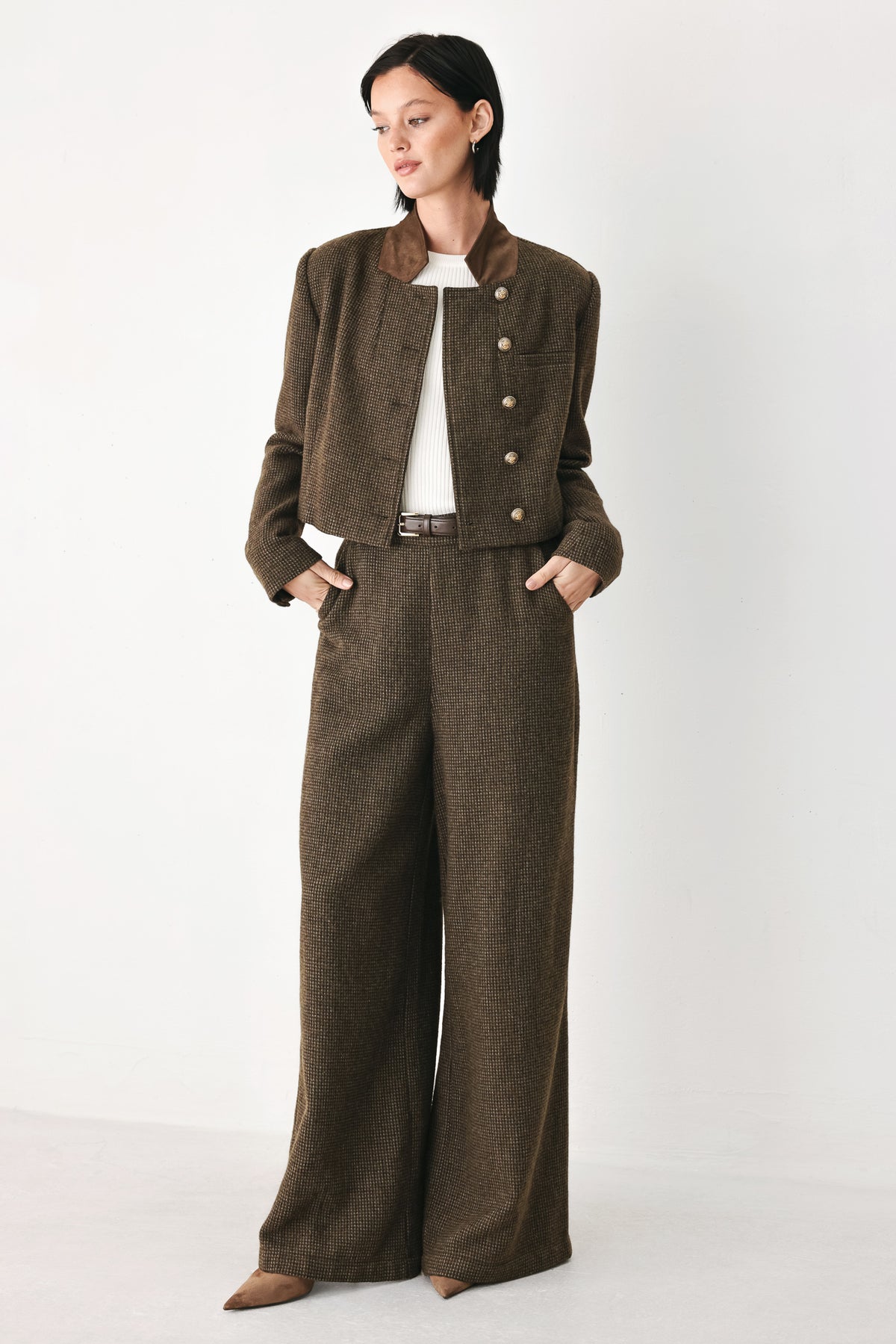 A model wearing a brown textured tweed jacket with a contrasting solid brown collar and decorative gold-tone buttons | FREEMARKET