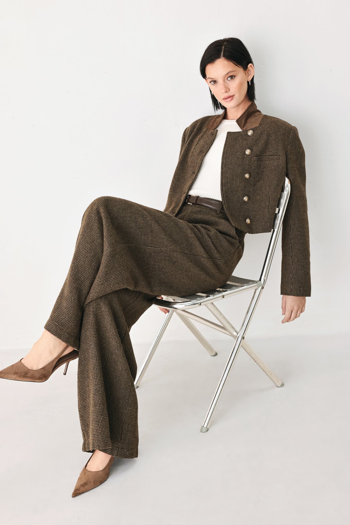 A model wearing a brown textured tweed jacket with a contrasting solid brown collar and decorative gold-tone buttons | FREEMARKET