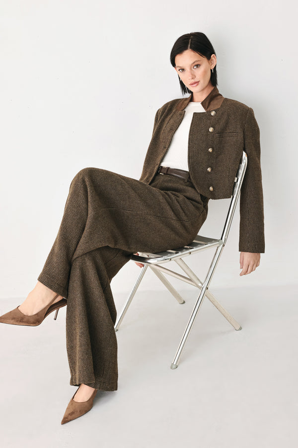 A model wearing a brown textured tweed jacket with a contrasting solid brown collar and decorative gold-tone buttons | FREEMARKET