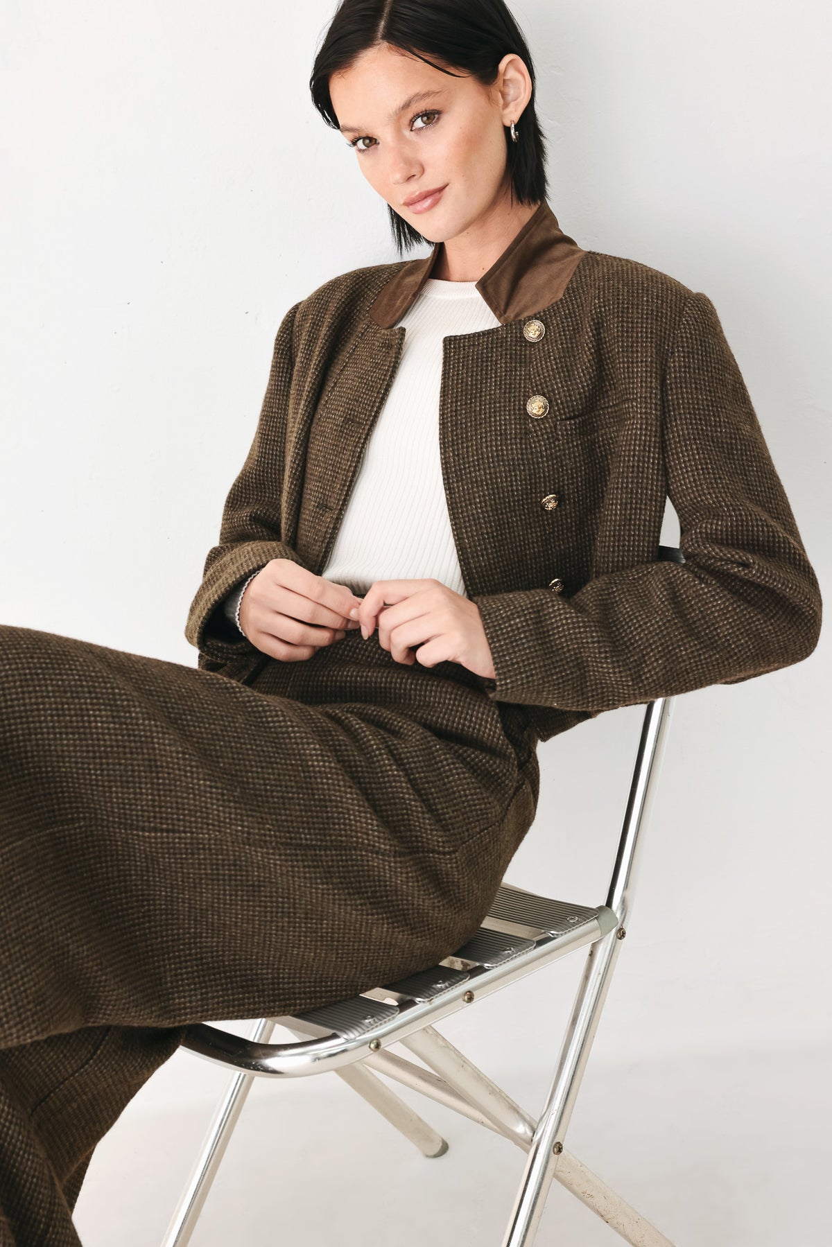 A woman wearing a brown houndstooth textured jacket  | FREEMARKET