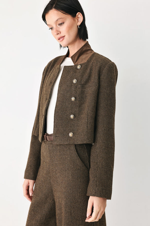 A model wearing a brown textured tweed jacket with a contrasting solid brown collar and decorative gold-tone buttons | FREEMARKET