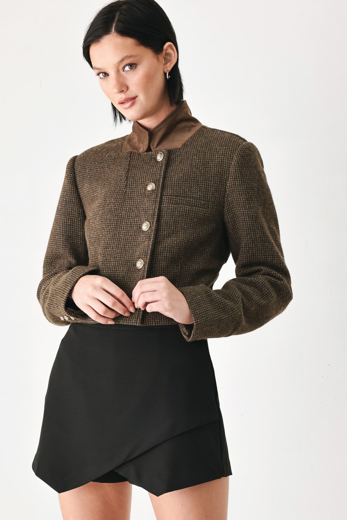 A model wearing a brown textured tweed jacket with a contrasting solid brown collar and decorative gold-tone buttons | FREEMARKET