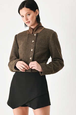 A model wearing a brown textured tweed jacket with a contrasting solid brown collar and decorative gold-tone buttons | FREEMARKET