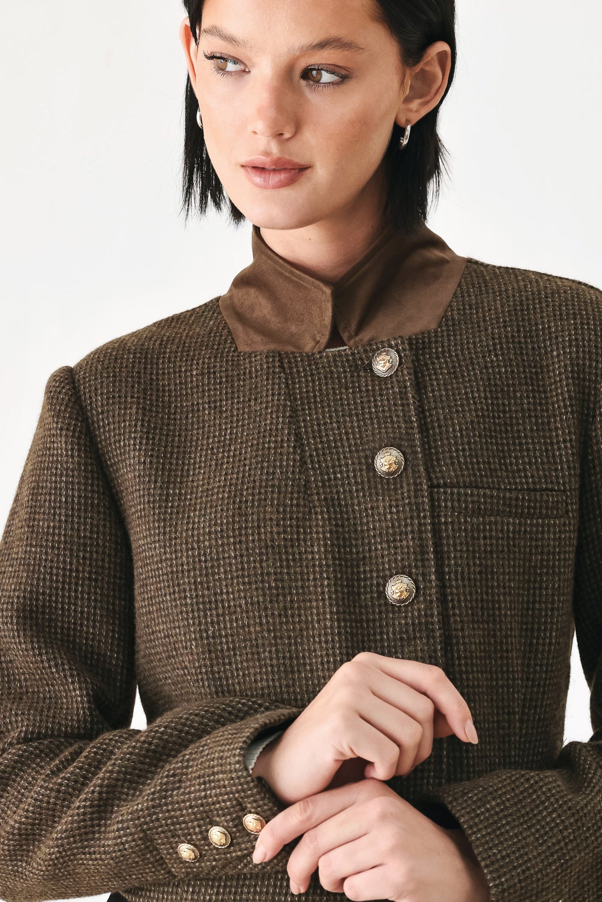 A model wearing a brown textured tweed jacket with a contrasting solid brown collar and decorative gold-tone buttons | FREEMARKET