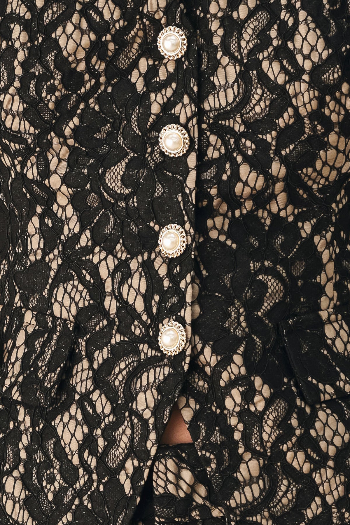A woman wearing a sleeveless black lace vest with a V-neckline, front buttons | FREEMARKET