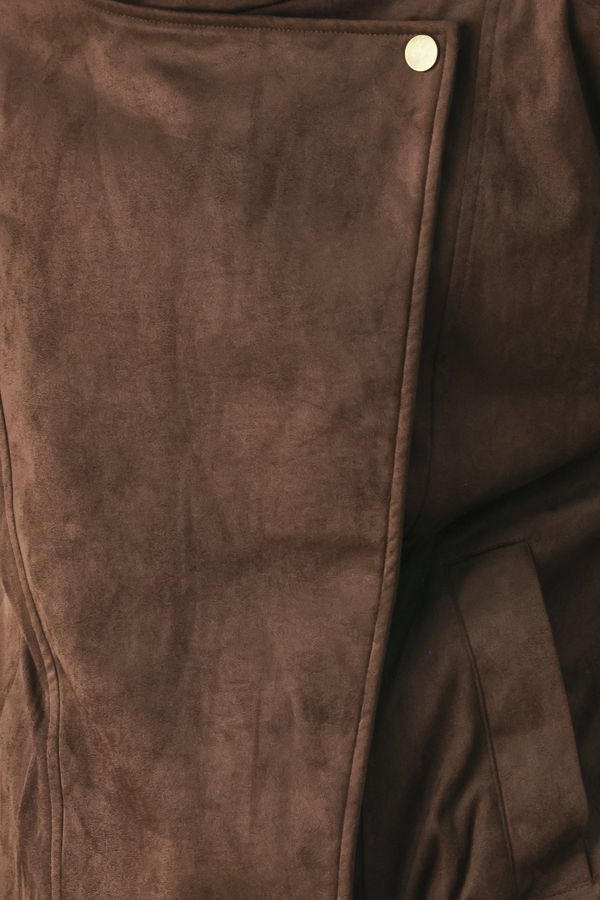 A woman wearing a dark brown suede jacket with a high collar and gold-tone snap buttons | FREEMARKET