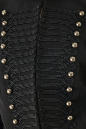 Woman wearing a long-sleeve mock neck black cropped jacket top with double breasted buttons and military style braiding | FREEMARKET