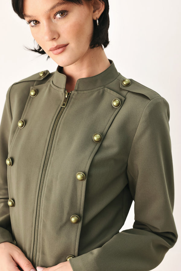 A model wearing an olive green military-style cropped jacket top with gold-tone double-breasted buttons, a front zipper, and a high mock neck | FREEMARKET