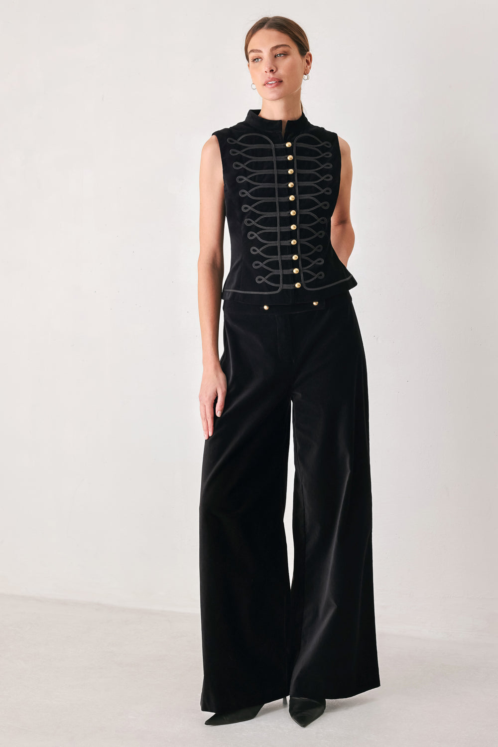 Model wearing a black velvet mandarin neck vest with military style stitching | FREEMARKET