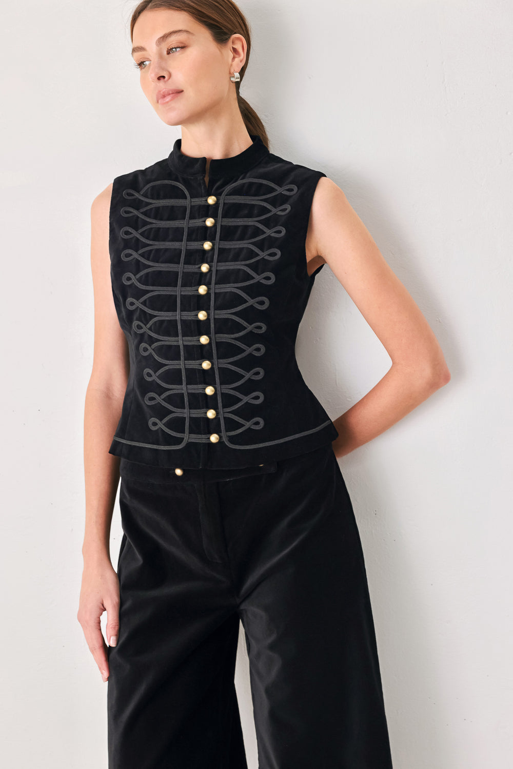 Model wearing a black velvet mandarin neck vest with military style stitching | FREEMARKET
