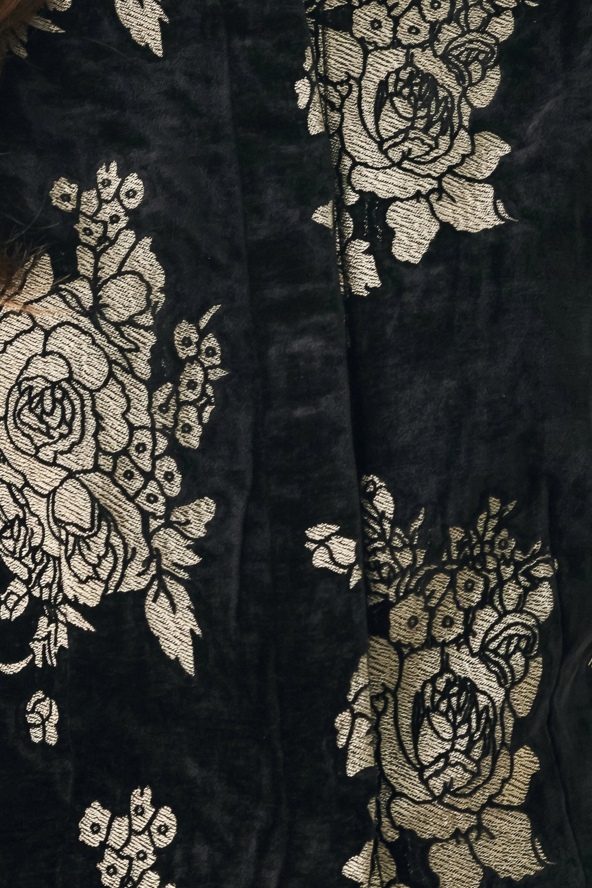 Woman wearing a black short sleeve cropped top/jacket with jacquard flowers | FREEMARKET