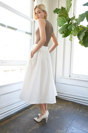 TALK TO THE SAND WOVEN MIDI SKIRT.