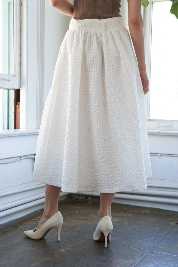 TALK TO THE SAND WOVEN MIDI SKIRT.