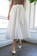 TALK TO THE SAND WOVEN MIDI SKIRT.