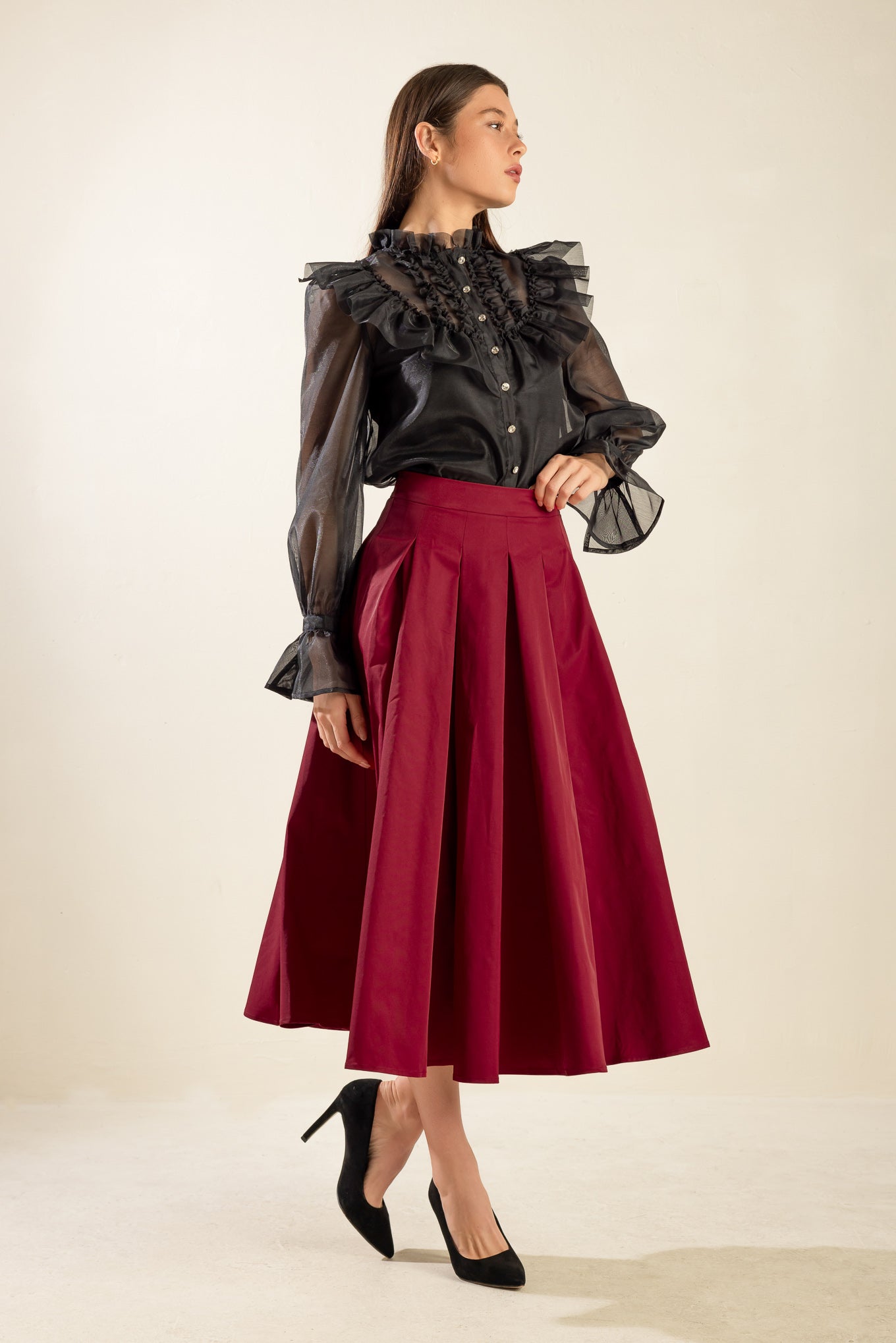 A solid woven full skirt with back zipper closure