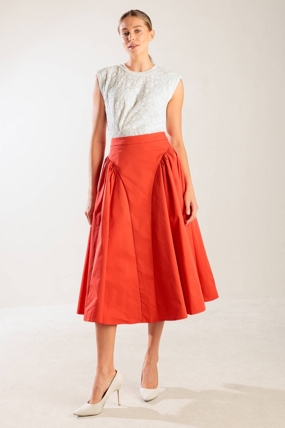 A solid tomato red woven full midi skirt with back zipper closure