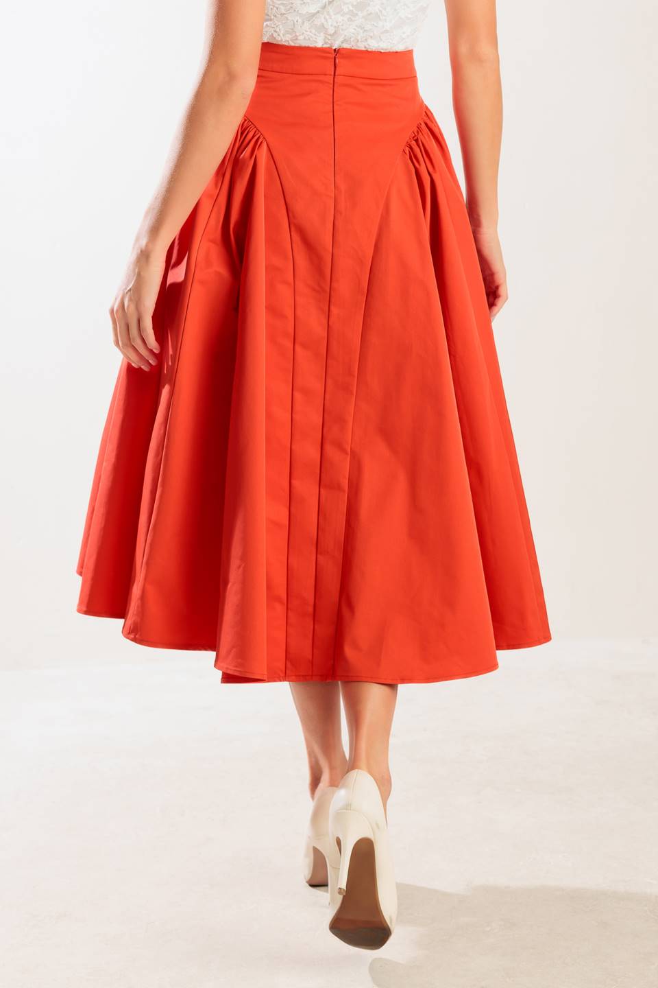 A solid tomato red woven full midi skirt with back zipper closure