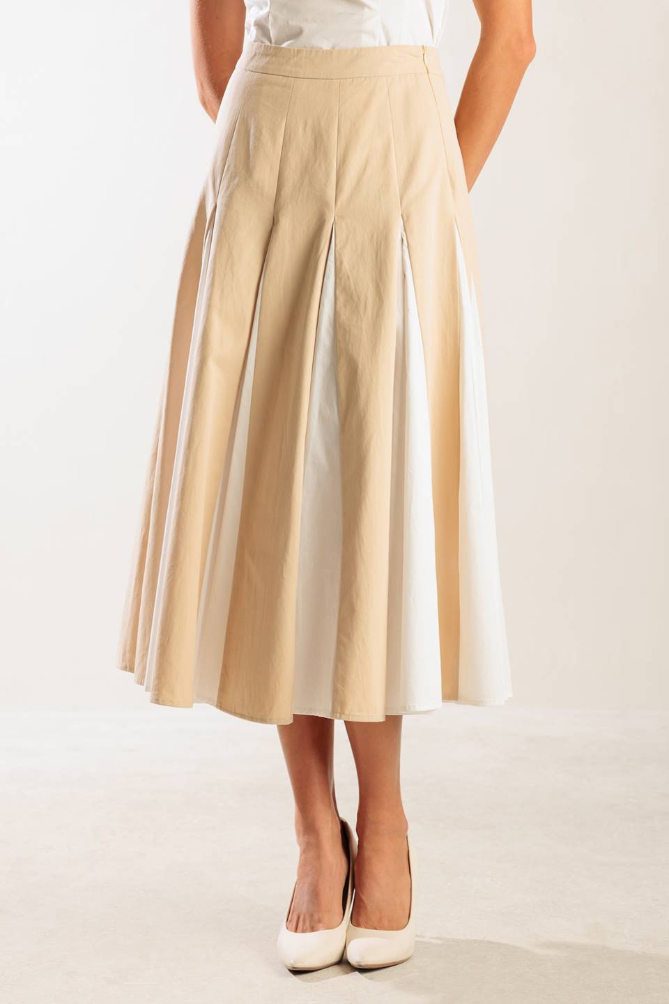 A solid woven midi skirt with side zipper and color blocked