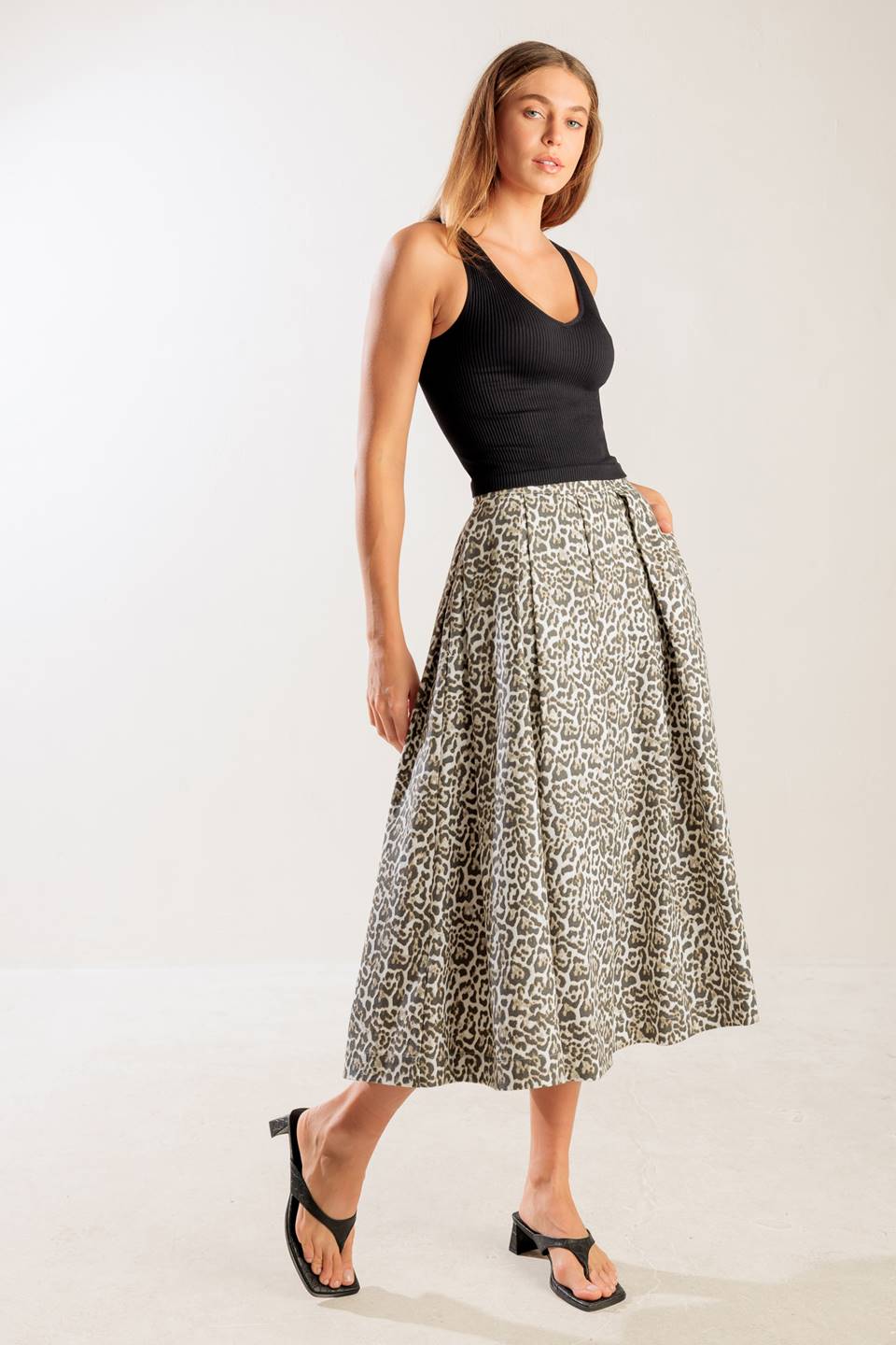 A leopard printed, woven midi full skirt a side zipper closure.