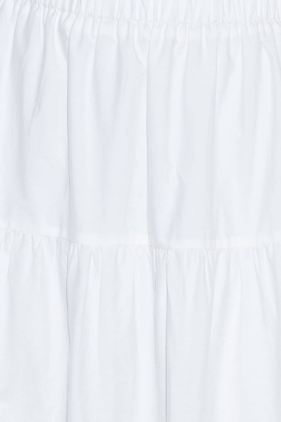 A woven maxi skirt featuring an elasticized waist and tiers.