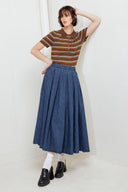 A washed denim full skirt with back zipper closure