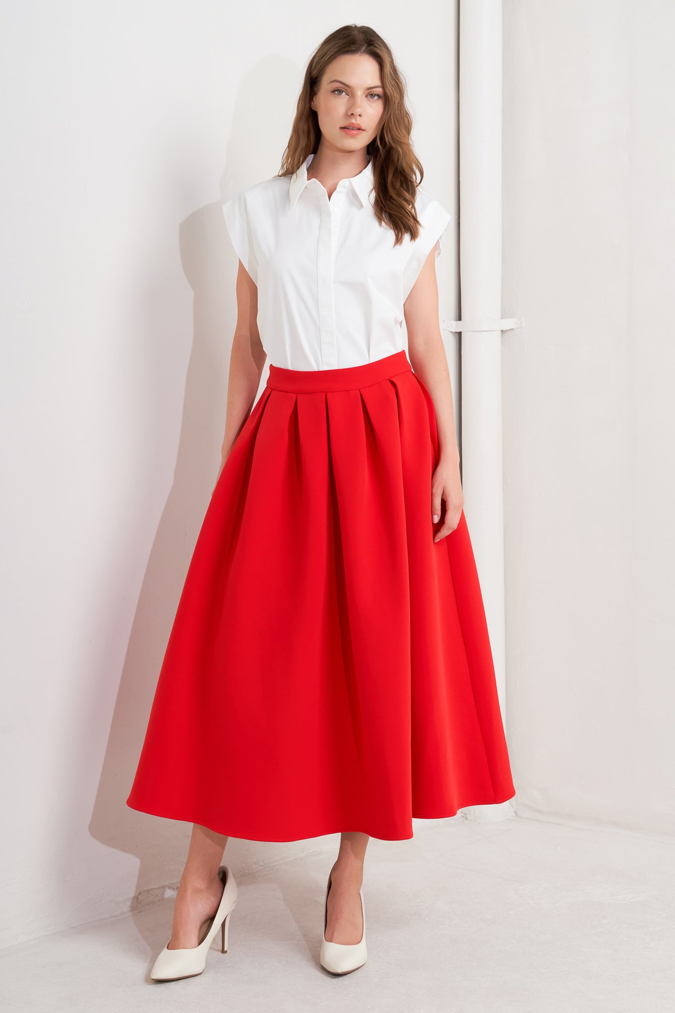 A solid red woven full midi skirt with back zipper closure