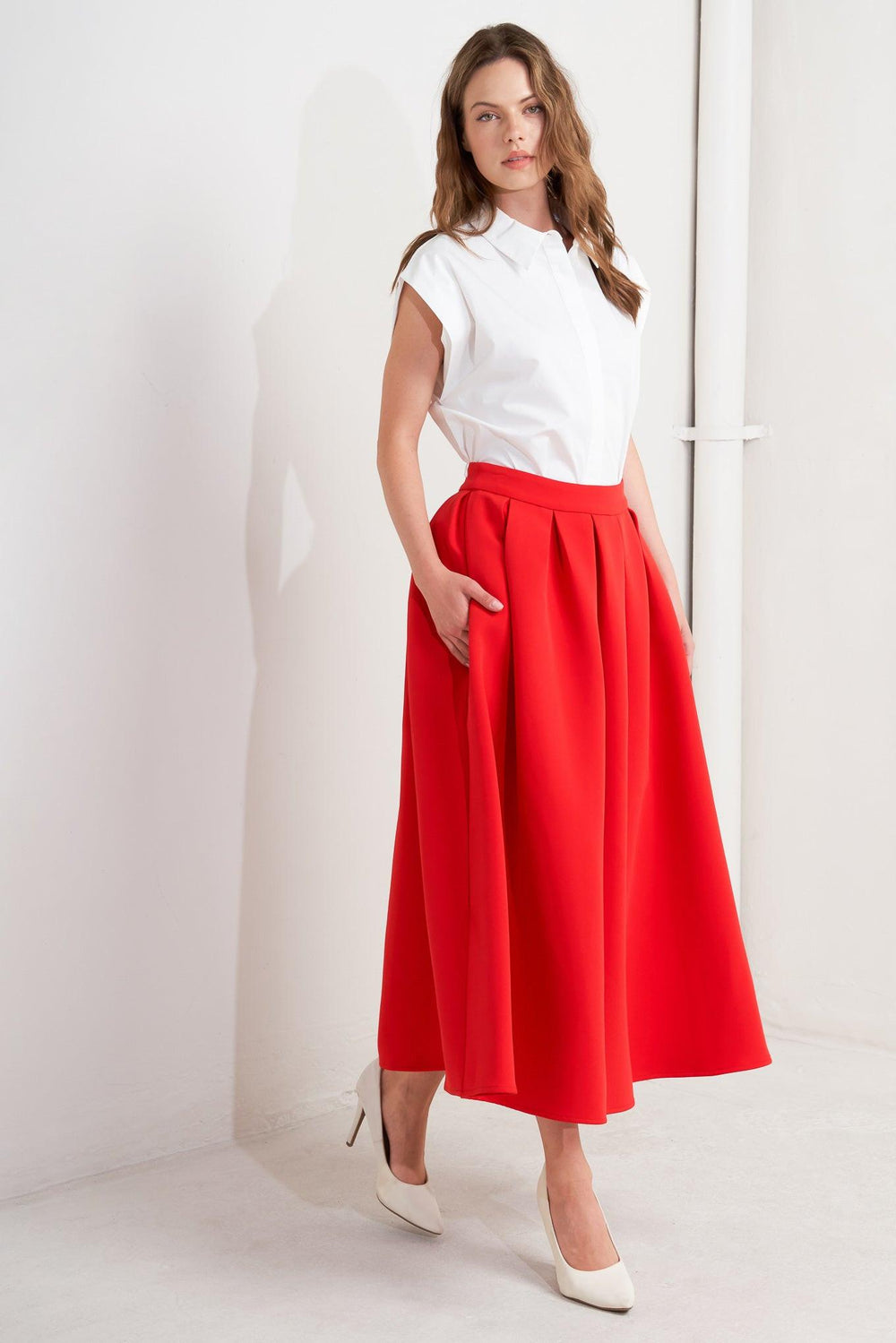 A solid red woven full midi skirt with back zipper closure