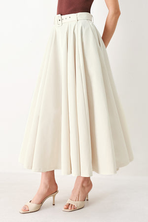 Woman wearing a white full midi skirt featuring self belt and side zipper closure | FREEMARKET