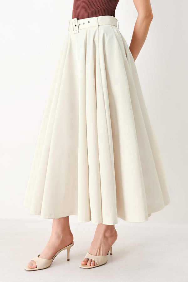 Woman wearing a white full midi skirt featuring self belt and side zipper closure | FREEMARKET