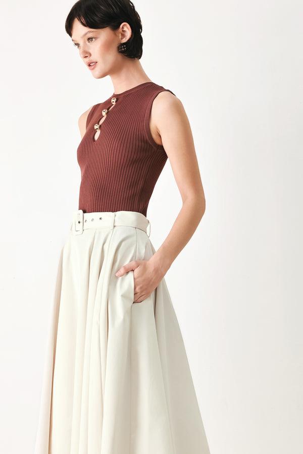Woman wearing a white full midi skirt featuring self belt and side zipper closure | FREEMARKET