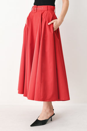 Woman wearing a red full midi skirt featuring self belt and side zipper closure | FREEMARKET