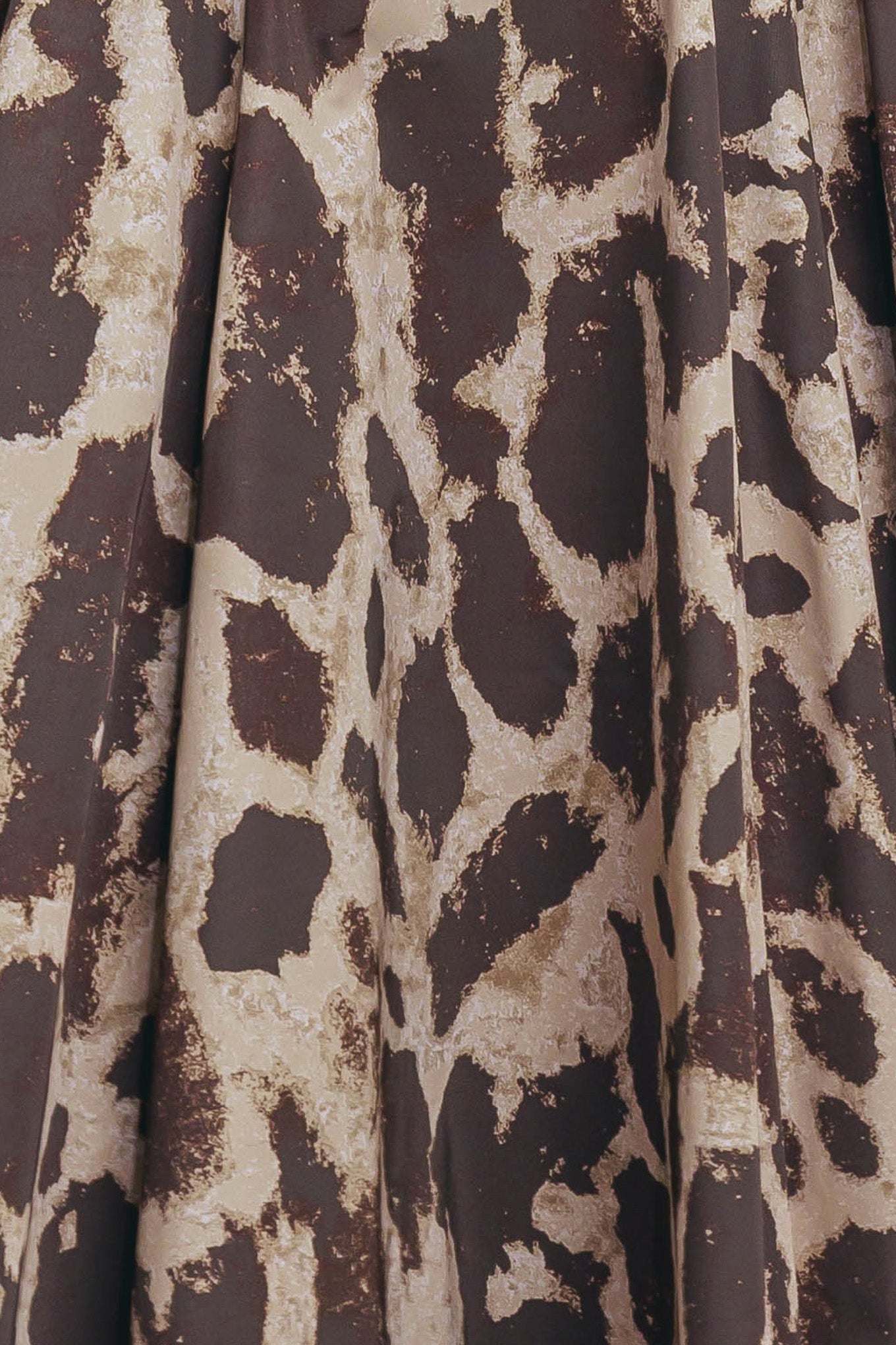 A printed woven full midi skirt featuring self belt, side pockets and zipper closure