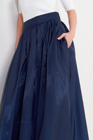 LUXE FLARE WOVEN PLEATED MIDI SKIRT.