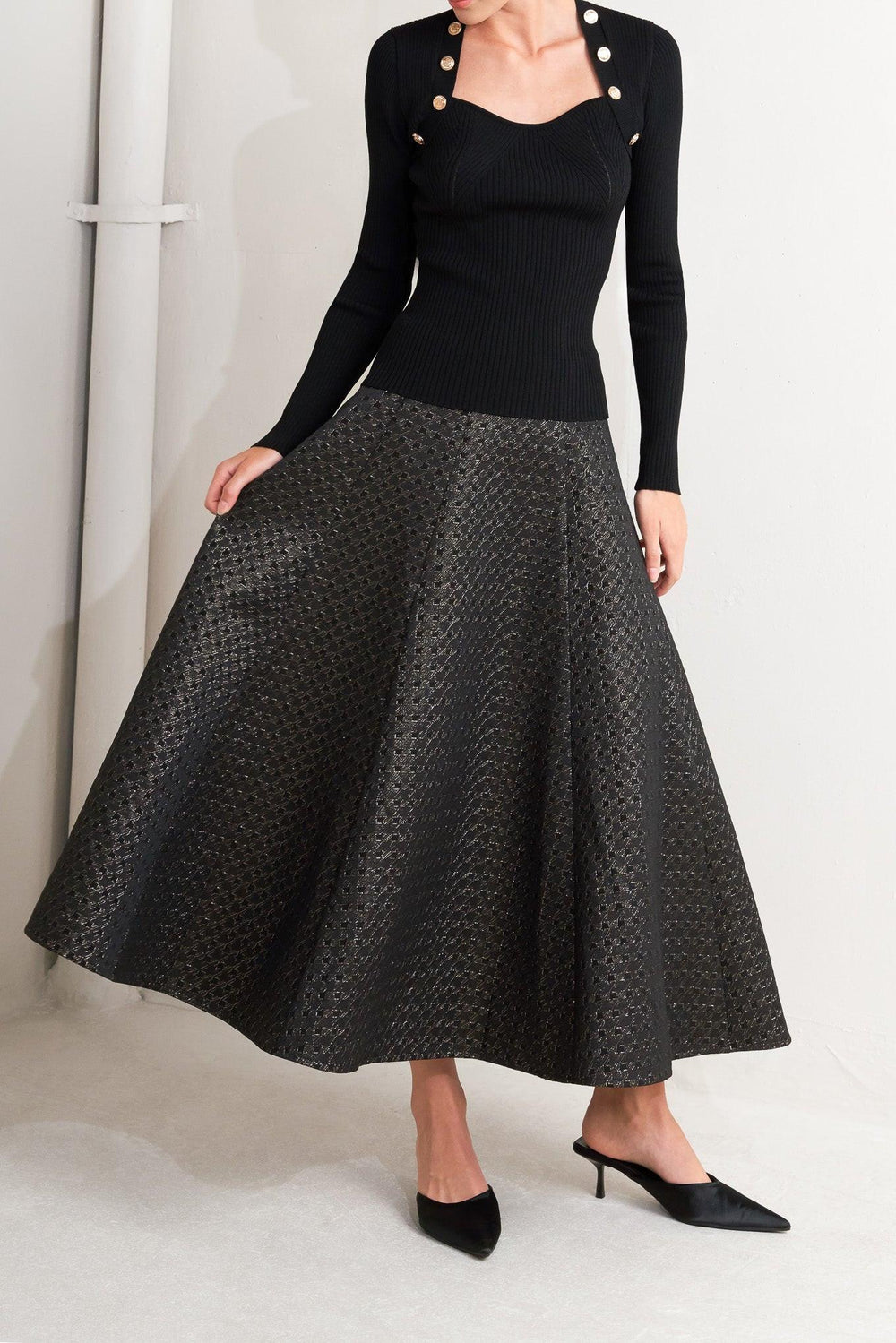 A textured metallic threaded woven circle skirt with back zipper closure.