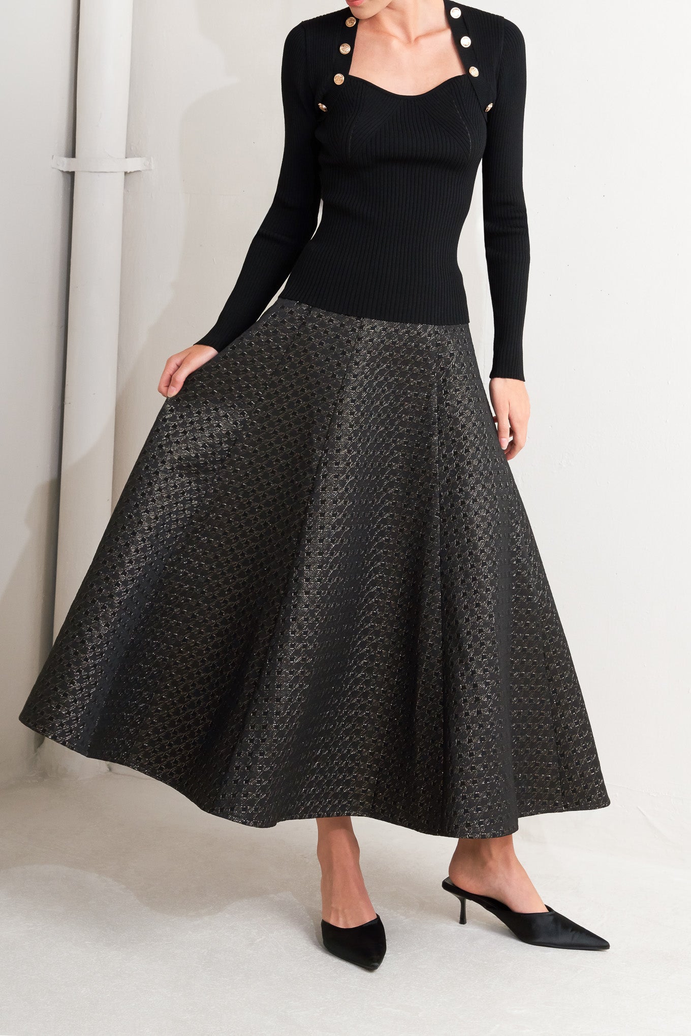 A textured metallic threaded woven circle skirt with back zipper closure.